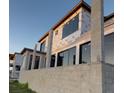 New home construction showing modern architectural details, large windows and concrete block structure at 242 Bangsberg Se Rd, Port Charlotte, FL 33952