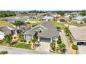 Beautiful single Gathering home with lush landscaping, golf course views and barrel tile roof in this active community at 24260 Westgate Blvd, Port Charlotte, FL 33980