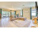 Spacious living room with comfortable seating, stylish decor, and large windows offering plenty of natural light at 264 Soliera St, Nokomis, FL 34275