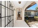 Open doorway showcases the tile flooring and interior layout, leading from the front entry into the house at 4438 Meager Cir, Port Charlotte, FL 33948