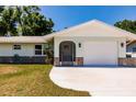 The entrance has stone accents and a charming screened-in porch that adds character to the property at 1357 Nimrod St, Port Charlotte, FL 33952