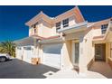 Condominium exterior featuring a private front entrance and attached garages for convenient parking at 240 West End Dr # 622, Punta Gorda, FL 33950
