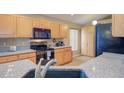 Functional kitchen with sleek black appliances, granite counters, and ample storage at 2699 Suncoast Lakes Blvd, Punta Gorda, FL 33980
