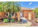 Inviting front entrance with a decorative door and well-maintained landscaping at 3287 Meadow Run Cir, Venice, FL 34293
