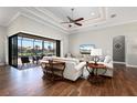 Comfortable living room leading to an outdoor pool area, perfect for indoor-outdoor entertaining at 347 Portofino Dr, Punta Gorda, FL 33950
