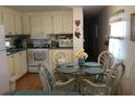 Cozy kitchen with dining area, modern appliances, and bright natural light at 5048 Palena Blvd, North Port, FL 34287