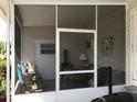 Relaxing screened-in lanai with comfortable seating area, perfect for outdoor enjoyment at 5048 Palena Blvd, North Port, FL 34287