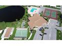 Aerial view of a community clubhouse with pool, tennis courts, bocce and shuffleboard courts at 861 Seabrooke Dr, Englewood, FL 34223