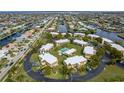 Aerial view of condos with central pool and convenient parking near picturesque waterways at 1080 Bal Harbor Blvd # 10C, Punta Gorda, FL 33950