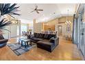 Spacious open-concept living area with hardwood floors, high ceilings and lots of natural light at 2363 Jasmine Way, North Port, FL 34287