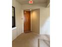 Condo entryway featuring a solid door and neutral tones, creating a private entrance to the unit at 3311 Purple Martin Dr # 126, Punta Gorda, FL 33950