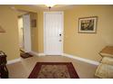 Inviting foyer featuring tile flooring and a stylish rug, offering a warm welcome into the home at 3311 Purple Martin Dr # 126, Punta Gorda, FL 33950
