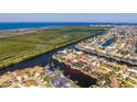 Aerial view of a waterfront home located on a canal with direct access to the open water at 3657 Aruba Ct, Punta Gorda, FL 33950