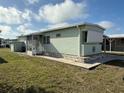 Cozy single-story home with green siding and a charming screened-in porch at 5025 Palena Blvd., North Port, FL 34287