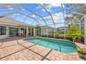 Relaxing screened-in pool area with brick patio, perfect for outdoor entertaining and enjoying the Florida lifestyle at 7344 Arrowhead Run, Lakewood Ranch, FL 34202