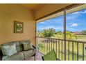 Relaxing screened lanai overlooking lush golf course views with comfortable seating at 1235 Saxony Cir # 5202, Punta Gorda, FL 33983
