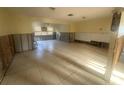 Spacious living room with tile flooring and lots of natural light, perfect for renovation at 134 Peace Island Dr, Punta Gorda, FL 33950