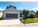 Charming single-story home boasts a two-car garage, well-maintained landscaping, and inviting curb appeal at 1872 Birmingham Blvd, Port Charlotte, FL 33980