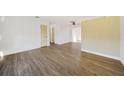 Spacious, bright room with wood-look flooring, and view to other rooms at 22220 Lasalle Rd, Port Charlotte, FL 33952