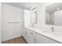 Bright bathroom featuring double sinks, modern lighting, and ample counter space at 2300 Nordendale Blvd, North Port, FL 34288