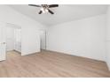 Bright bedroom with light-colored wood flooring and a modern ceiling fan at 2300 Nordendale Blvd, North Port, FL 34288
