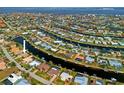 Wide aerial shot of canal-front homes, highlighting the waterfront living and community layout at 2310 El Cerito Ct, Punta Gorda, FL 33950