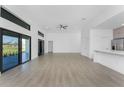 Open-concept living room with tile floors and large sliding doors to the backyard at 24294 Santa Inez Rd, Punta Gorda, FL 33955