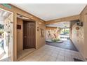 Inviting entryway with unique decor, tiled floors, and skylight bringing in plenty of natural light at 3123 David St, Punta Gorda, FL 33982