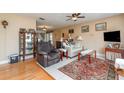 Cozy living room featuring comfortable seating, hardwood floors, and tasteful décor at 402 Cicero Nw St, Port Charlotte, FL 33948