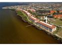 An aerial view of the condo complex near the water with other buildings in the background at 95 N Marion Ct # 126, Punta Gorda, FL 33950