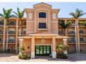 The building's entrance features lovely landscaping, a red tile roof and an upscale exterior at 95 N Marion Ct # 126, Punta Gorda, FL 33950