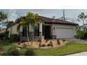 Charming one-story home with meticulously designed landscaping and a paver driveway at 1263 Cicely Ct, North Port, FL 34289