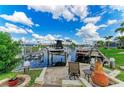 Waterfront property featuring a private dock with boat lifts, providing direct access to open waters and boating opportunities at 200 Capri Isles Ct, Punta Gorda, FL 33950