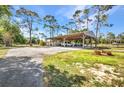 Large carport area, ideal for boat or RV storage, providing covered parking and protection from the elements at 29324 Leah Rd, Punta Gorda, FL 33982