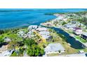 Aerial view showcasing the property's waterfront location and dock on a scenic canal at 352 Oak St, Englewood, FL 34223
