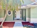 Charming entrance with a decorative window and a welcoming front door at 3721 Adelaide Ave, North Port, FL 34288