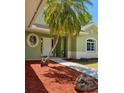 Lovely single-story home featuring well-maintained landscaping and an inviting walkway to the entrance at 3721 Adelaide Ave, North Port, FL 34288