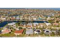 Expansive aerial view showcases the waterfront community, canal access, and neighborhood layout at 441 Norma Ct, Punta Gorda, FL 33950