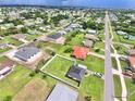 A stunning aerial view of the neighborhood showcasing the layout, nearby amenities, and well-maintained homes at 3324 Port Charlotte Blvd, Port Charlotte, FL 33952