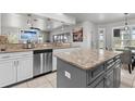 Modern kitchen with stainless steel appliances, granite countertops, and island perfect for cooking at 384 Viedma St, Punta Gorda, FL 33983