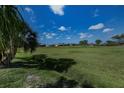 Beautiful backyard overlooking a lush green golf course, perfect for outdoor enjoyment and relaxation at 5061 San Rocco Ct, Punta Gorda, FL 33950