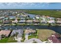 Stunning aerial view of the home's location on a canal with convenient access to the ocean at 571 Port Bendres Dr, Punta Gorda, FL 33950