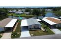 A waterfront home with lush landscaping and community lake views in a peaceful 55+ neighborhood at 749 Watersedge St, Englewood, FL 34223