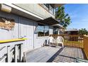 Charming outdoor deck with seating area, offering a relaxing space for enjoying the outdoors and views at 1851 Scenic Dr, Venice, FL 34293