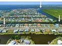 Expansive aerial shot showcasing the waterfront community and surrounding waterways at 21169 Edgewater Dr, Port Charlotte, FL 33952