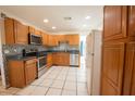 Functional kitchen with stainless steel appliances, tiled backsplash and spacious countertops at 2230 Harbor Blvd, Port Charlotte, FL 33952