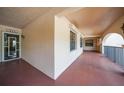 Exterior hallway with an open door and a view of the interior at 23465 Harborview Rd # 925, Punta Gorda, FL 33980