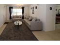 Comfortable living room with modern furniture, opening into the dining area at 4158 Tamiami Trl # G1, Port Charlotte, FL 33952