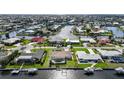 Stunning aerial view of waterfront neighborhood featuring canals and direct access to the gulf with boat docks at 530 Matares Dr, Punta Gorda, FL 33950
