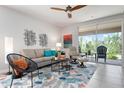 Bright living room with stylish furniture, decorative accents, and sliding glass doors to the outdoor area at 7209 W Lenox Cir, Punta Gorda, FL 33950